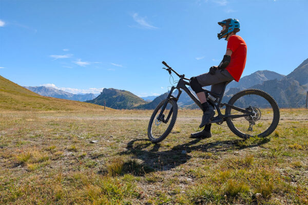 Elliot in profile, waiting on the next descent at Serre Chevalier, French Alps 2025