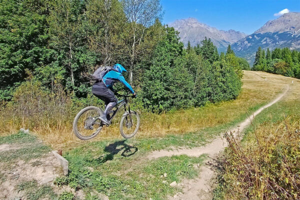 Prof clears a drop off and gap on a red run