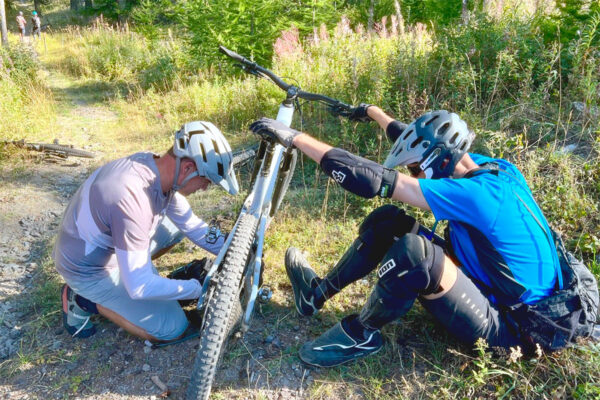 Lloyd and Steve complete a trailside repair of his crankarm