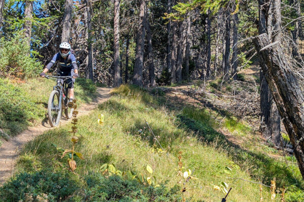 John descends on steep singletrack