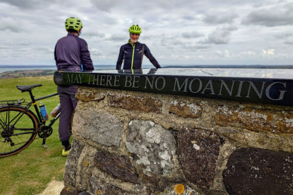 Cyclists at the Tennyson Memorial - May there be no moaning