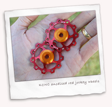 KCNC anodised red jockey wheels